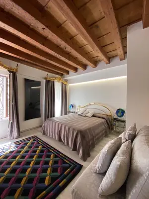 Letto o letti in una camera di LN HOMES VENICE - San Marco Canal View