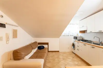 Cucina o angolo cottura di Mansarda 7 Trilocale, Bafile241 - 2' Piano NO Ascensore - Adria Holiday Jesolo - FAMILY APARTMENT