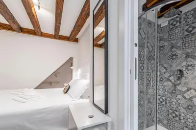 Letto o letti in una camera di Santa Fosca Cozy Apartment