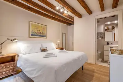 Letto o letti in una camera di Santa Fosca Cozy Apartment