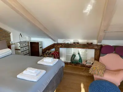 Letto o letti in una camera di Biennale Gallery Loft