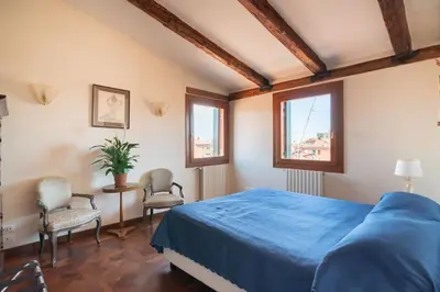 Letto o letti in una camera di Penthouse with Rooftop Terrace and 360 Views of Venice - Venice5th