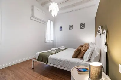 Letto o letti in una camera di Ca' d'Oro Cozy Suite by Wonderful Italy