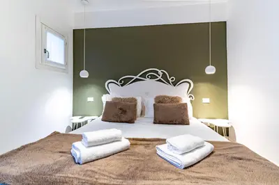 Letto o letti in una camera di Ca' d'Oro Cozy Suite by Wonderful Italy