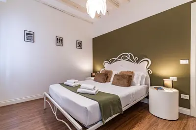 Letto o letti in una camera di Ca' d'Oro Cozy Suite by Wonderful Italy