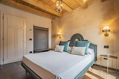 Letto o letti in una camera di Corte Rubbi 9 Canal View -Dimora Italia -