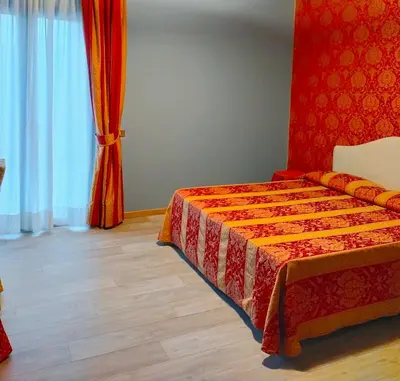 Letto o letti in una camera di LAERTE PALACE HOTEL