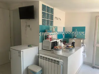 Cucina o angolo cottura di LAGUNA BLU Camera CIELO con terrazza panoramica in comune