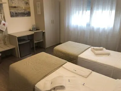Letto o letti in una camera di Alloggi Al Melograno