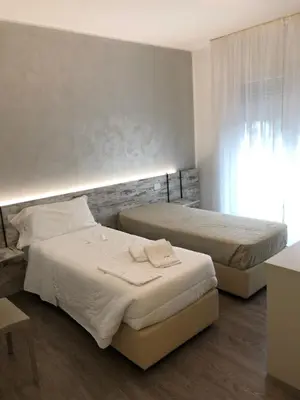 Letto o letti in una camera di Alloggi Al Melograno