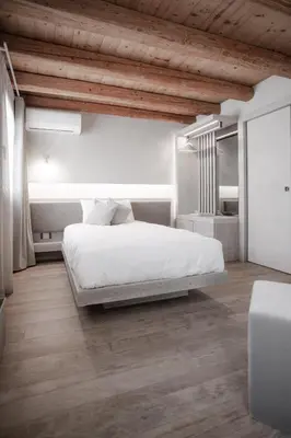 Letto o letti in una camera di Locanda MaMaGiò