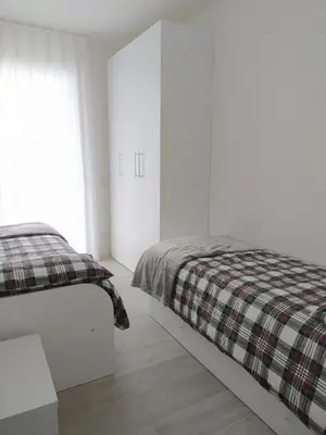 Letto o letti in una camera di Jesolo Appartamenti F2 - Light Blue