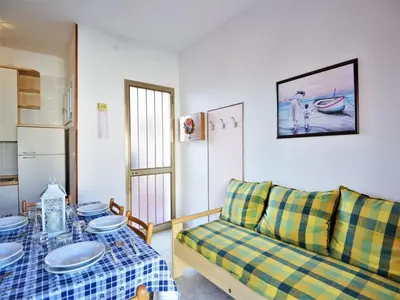 Area soggiorno di Nice holiday home in Rosolina Mare with a terrace