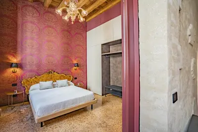 Letto o letti in una camera di Corte Rubbi 7 Deluxe Apartment