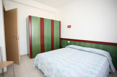 Letto o letti in una camera di Residence Capinera