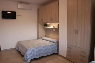 Letto o letti in una camera di Residence Capinera