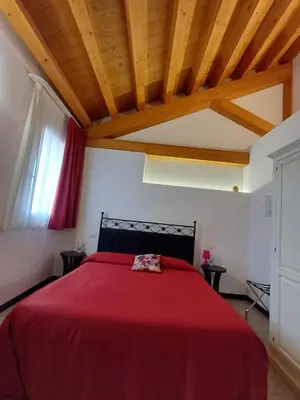 Letto o letti in una camera di Arneroni