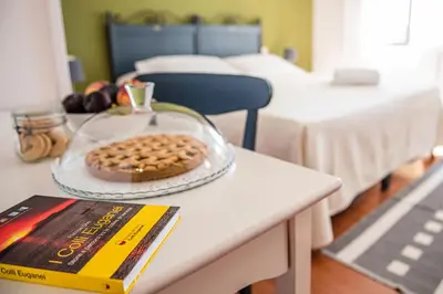 Letto o letti in una camera di Fattoria Busa dell'Oro