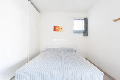 Letto o letti in una camera di Residence Santa Fè Immobiliare Pacella