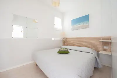 Letto o letti in una camera di Residence Santa Fè Immobiliare Pacella
