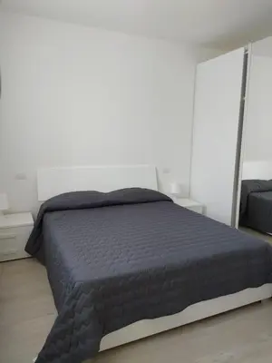 Letto o letti in una camera di Jesolo Appartamenti F2 - Coral Red
