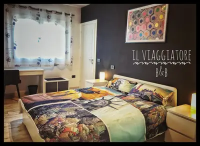 Letto o letti in una camera di Il Viaggiatore B&B