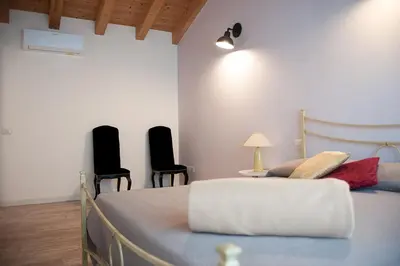 Letto o letti in una camera di Al Giorgione