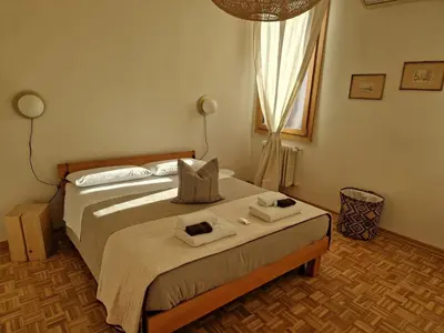 Letto o letti in una camera di Residenza La Veranda a Rialto