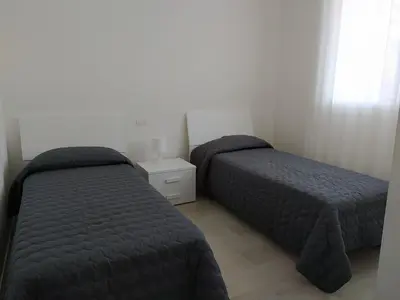 Letto o letti in una camera di Jesolo Appartamenti F2 - Black and White