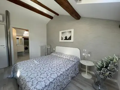 Letto o letti in una camera di Residenza Casanova, appartamento in Giudecca