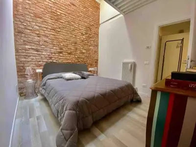 Letto o letti in una camera di Residenza Casanova, appartamento in Giudecca