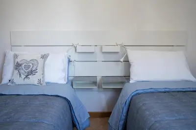 Letto o letti in una camera di All’Altana b&b apartment