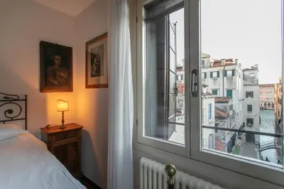 Letto o letti in una camera di Ca' al Giglio - Appartamento Vista Canale