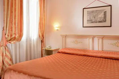 Letto o letti in una camera di Ambassador Tre Rose