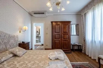Letto o letti in una camera di Hotel La Meridiana