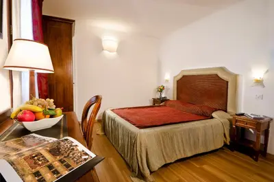 Letto o letti in una camera di Hotel Giardinetto Venezia