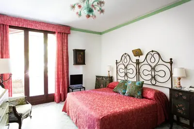 Letto o letti in una camera di Residenza d'Epoca Albergo Quattro Fontane