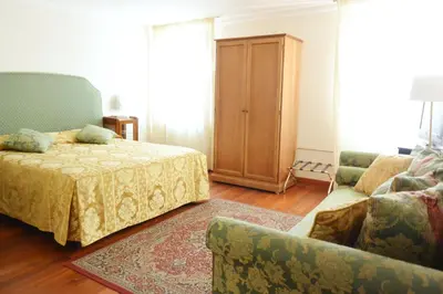 Letto o letti in una camera di Hotel San Zulian