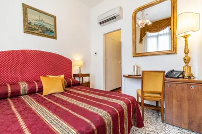 Letto o letti in una camera di Palazzo Schiavoni Residenza d'epoca & Suite-Apartments