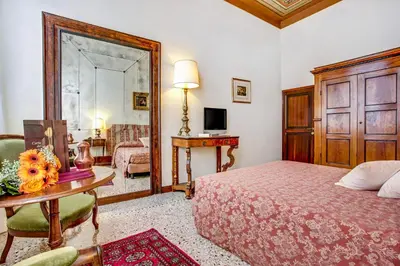 Letto o letti in una camera di Palazzo Schiavoni Residenza d'epoca & Suite-Apartments