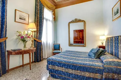 Letto o letti in una camera di Palazzo Schiavoni Residenza d'epoca & Suite-Apartments