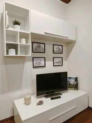 TV o dispositivi per l'intrattenimento presso Casa Locatelli - Apartment Deluxe & Suite