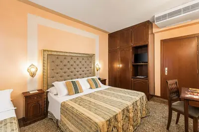 Letto o letti in una camera di Hotel Marconi
