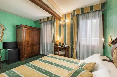 Letto o letti in una camera di Hotel Marconi
