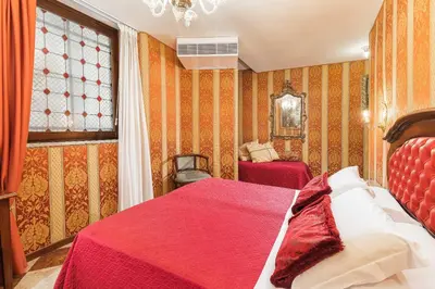 Letto o letti in una camera di Hotel Marconi