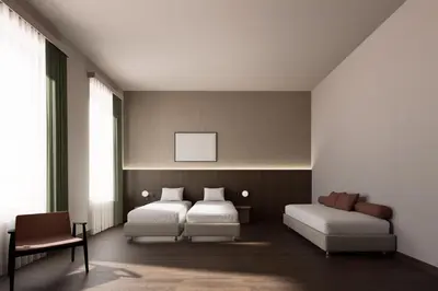 Letto o letti in una camera di BYPILLOW Grand Central