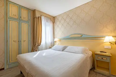 Letto o letti in una camera di Hotel Falier