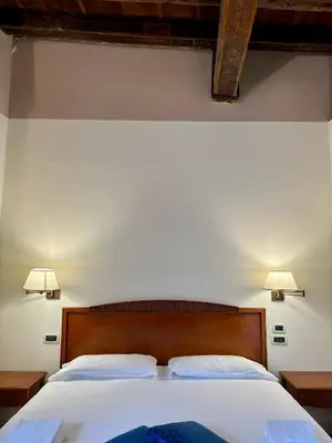 Letto o letti in una camera di Locanda del Ghetto