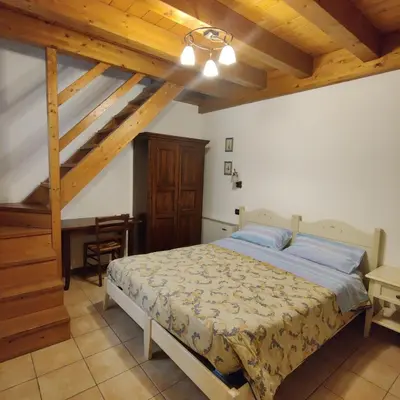 Letto o letti in una camera di Agriturismo L'Albara - Wines, Pool & SPA