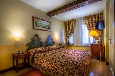 Letto o letti in una camera di Palazzo Marcello Hotel Al Sole